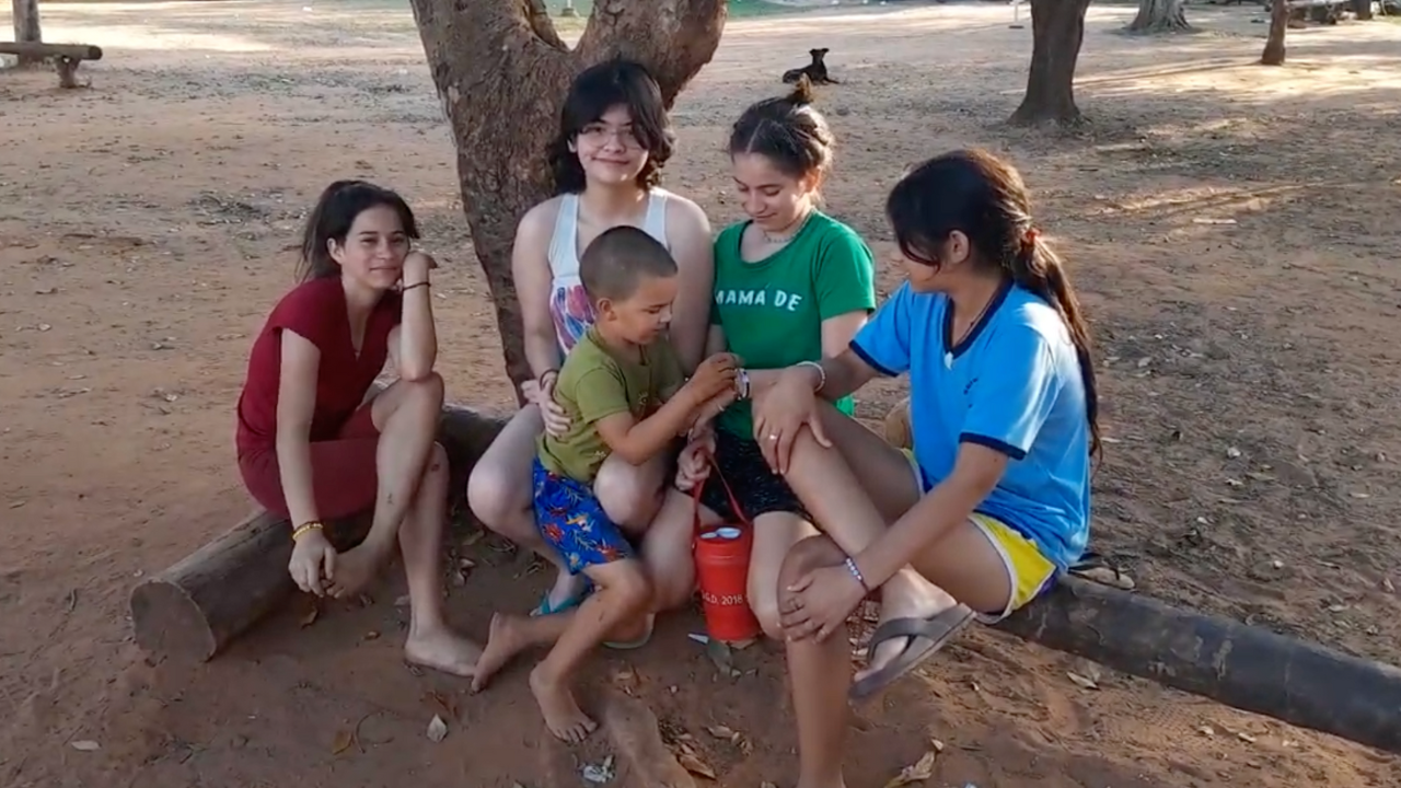 Sam being welcomed by friends in Paraguay